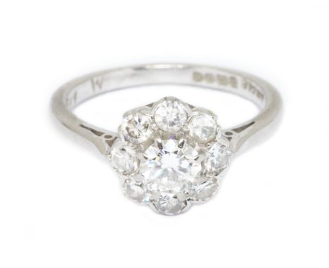 A mid 20th century diamond cluster ring, the central stone weighing approximately 0.43 carats, surrounded by eight further di