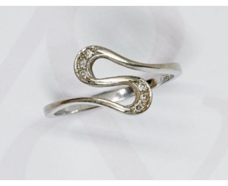 A white metal S design diamond cluster ring, band marked '585', gross weight 2.8g, size P.  