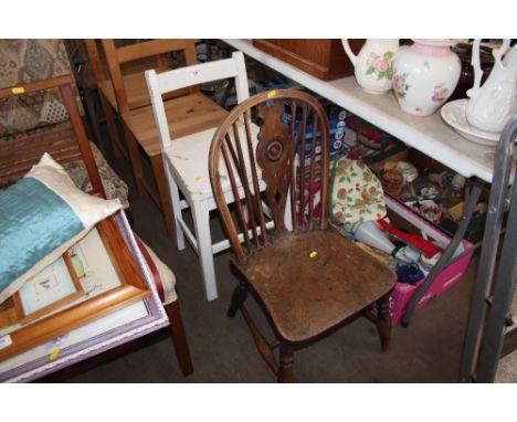 A white painted children's chair together with a stick back chair 
