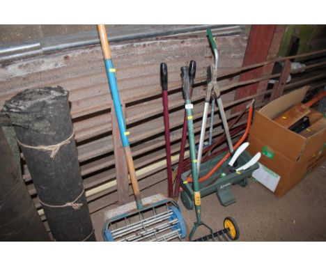 A quantity of tools to include Levington seed spreader etc. 