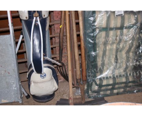 A quantity of long handled gardening tools 