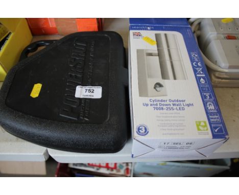 A Powershot stapler together with an outdoor light 