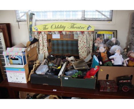 A puppet theatre together with a large quantity of various puppets and accessories