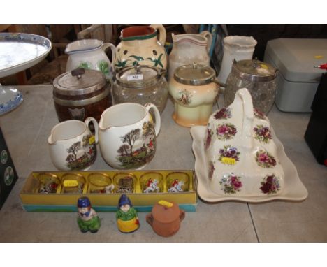 A quantity of china to include cheese dish and cover; saddler hunting scene jugs; four biscuit barrels etc. 