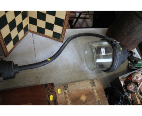 A street lamp and glass shade 