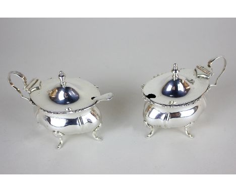 A pair of George VI silver mustards, maker's mark worn, Birmingham 1945, together with an Edwardian silver salt spoon, 4.5oz