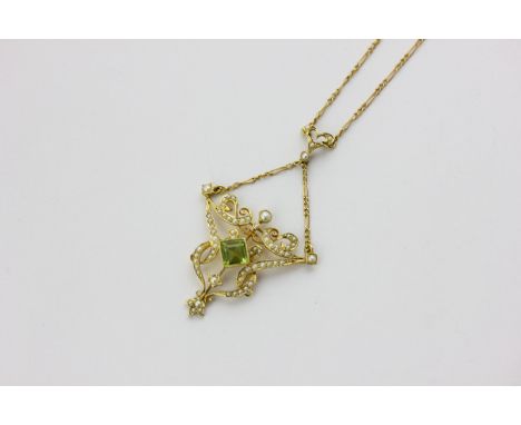A peridot and split pearl pendant on a curb link chain