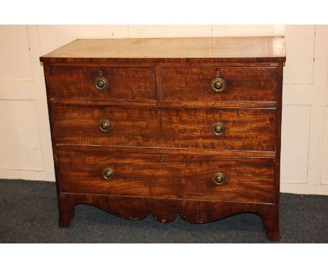 A George III mahogany chest of two short over two long drawers, with brass drop ring handles, on splayed bracket feet, 109cm