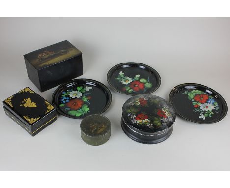 A Russian black enamel circular box decorated with flowers, Beriozka label, a pair of similar plates, a rectangular box, the 