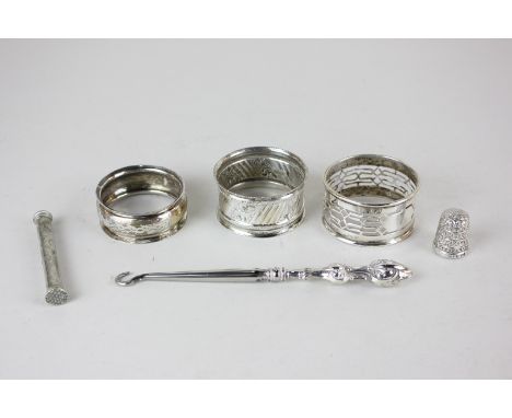 An Edward VII silver napkin ring, maker Charles Weale, Birmingham, 1903, a silver napkin ring by Brockington Brothers, Cheste