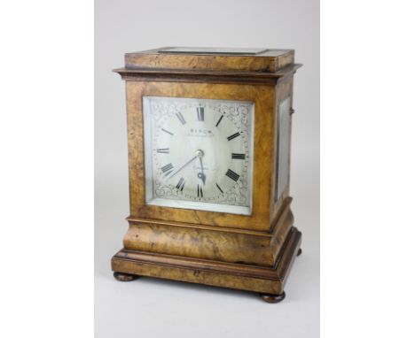 A 19th century mantle clock by Birch, London, rectangular silvered dial with Roman numerals, in walnut case with glass panell