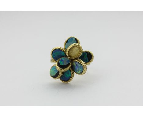 A black opal doublet dress ring in a textured 18ct gold mount (a/f), 12.8g gross