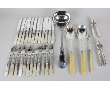 A silver plated soup ladle, a pair of Mappin & Webb silver plated salad servers, a toasting fork, a pair of nut crackers, and