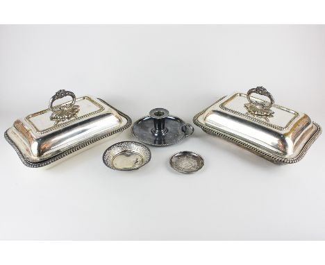 A pair of silver plated rectangular entree dishes with floral scroll handles, a silver plated chamber stick, a bonbon dish an