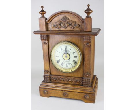 A Fattorini and Sons, Bradford oak mantle clock, with two train movement, circular dial in architectural case, (a/f) 43cm