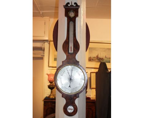 A 19th century walnut banjo wall barometer thermometer with swan neck surmount, silvered dial and level, marked J Deck, Leami