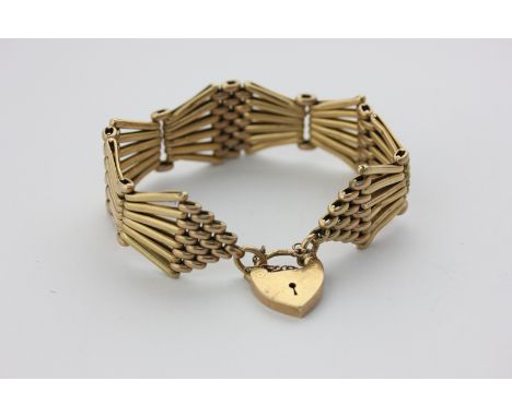 An 18ct gold gate link bracelet with padlock clasp, 37g