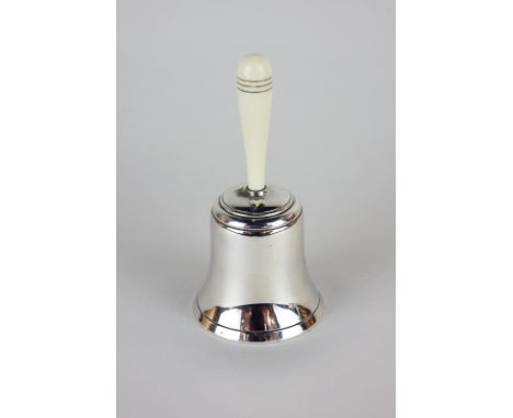 A Dunhill silver plated table lighter in the form of a bell, with white handle, 16cm high