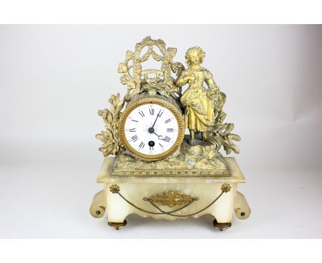 A French gilt spelter mantle clock, with drum cased movement, the white enamel dial with Roman and Arabic numerals, the case 