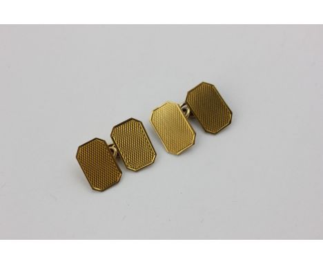 A pair of 9ct gold engine turned cufflinks