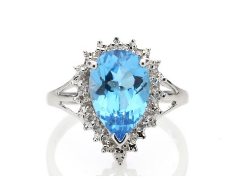 A stunning pear shaped Blue Topaz 3.23 carats sits surrounded by a halo set with four single cut diamonds in this gorgeous 9c