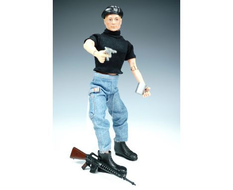 An Action Man figure, together with clothing etc