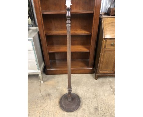 A turned wooden standard lamp