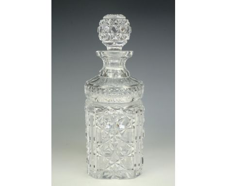 A heavy cut glass spirit decanter, of distinctive form, 27 cm