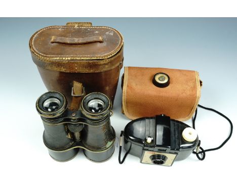 A set of late 19th / early 20th Century binoculars together with a 1950s Kodak Brownie 127 camera and a small Bakelite compas