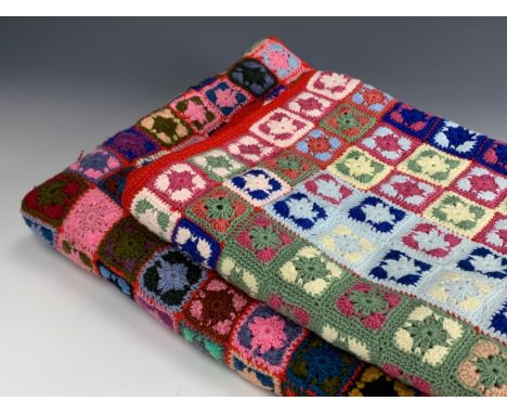 Two vintage hand crocheted sofa / armchair blankets, worked in a multi-colour floral square pattern