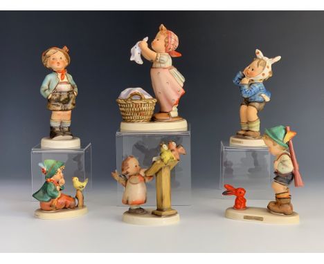 Six Hummel figurines including Wash Day, Toothache, Sensitive Hunter etc