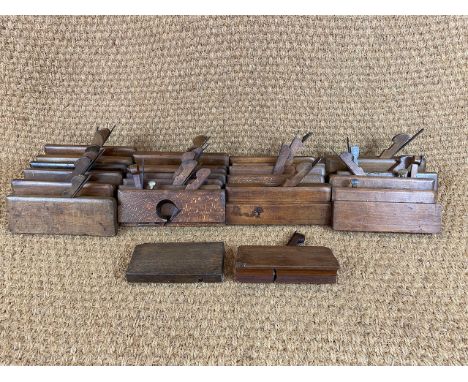 A quantity of antique woodworking moulding planes / tools