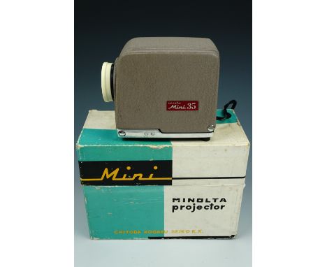 A 1960s Minolta Mini Projector, cased and boxed