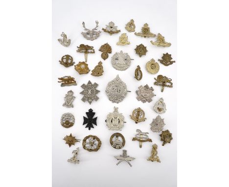 A quantity of British army cap badges