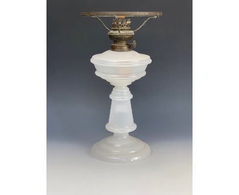 A Victorian milk glass oil lamp