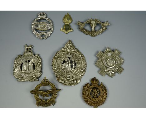 Sundry British army cap badges, a South African Air Force cap badge etc