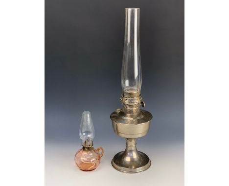 A Super Aladdin paraffin lamp together with a finger oil lamp