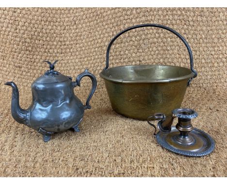 A brass jam pan, a Victorian Britannia metal teapot and a chamber stick