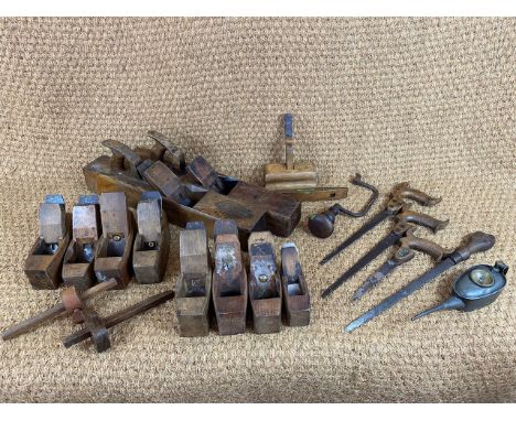 A quantity of antique woodworking planes / tools