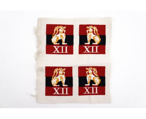 An un-cut group of four Second World War Far East theatre 12th Army uniform badges