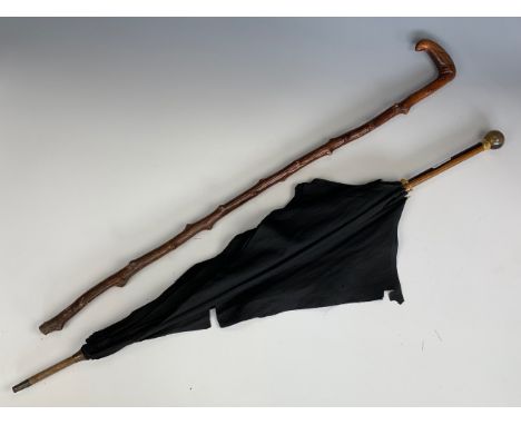 A vintage blackthorn walking stick together with an umbrella