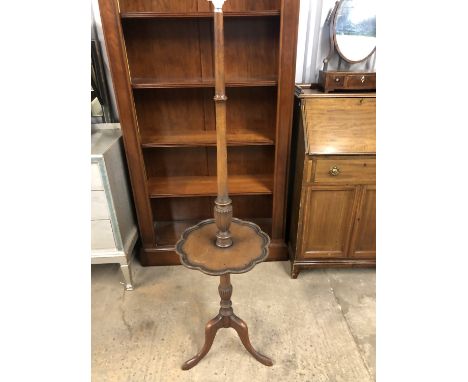 A turned wooden standard lamp