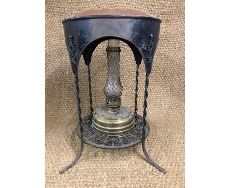 A Victorian cast and wrought iron heated conservatory table / stand, with enamelled top and paraffin lamp, 45 cm x 67 cm high