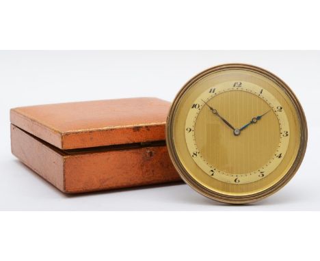 A Swiss 8 day desk circular timepiece, the 7.5cm engine turned dial with Arabic numerals, the case numbered 2495, original ca