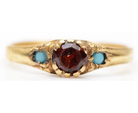 A Victorian gold, garnet and turquoise three stone ring, carved shoulders, N, 1.6gm 