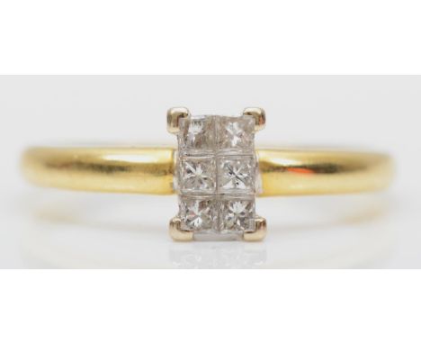 An 18ct gold six Princess cut diamond panel ring, stated weight 0.20cts, O, 2.3gm 