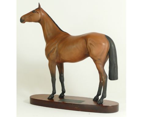 A Beswick figurine, modelled as a chestnut horse, Red Rum, raised upon an oval base with plaque detailed 'Red Rum Winner of T