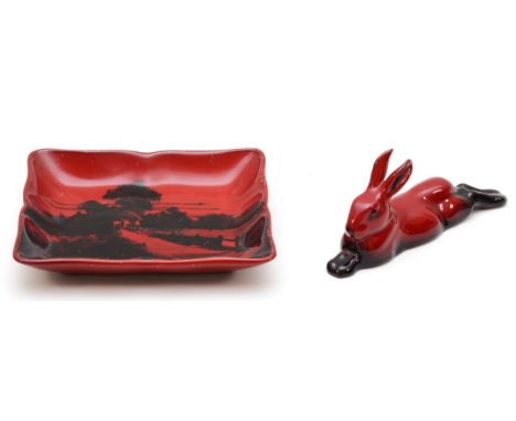 A Royal Doulton glazed ceramic pin dish, 'Flambe' pattern, together with a matching model of an outstretched hare.(2) 
