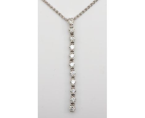 An 18K white gold and diamond line pendant, 40mm, claw set with nine brilliant cut diamonds, total weight approximately 0.60c