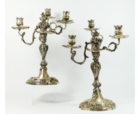 A German 19th century pair of three light silver candelabra, Augsburg date letter P, by IPH, zigzag, in the 18th century styl